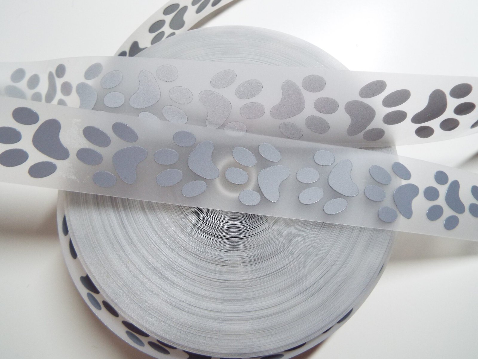 Silver Reflective Paw Print Iron-On Tape 25mm – 1 Metre Safety Trim for Pet Clothing, Harnesses & Accessories